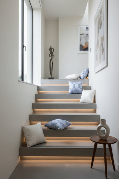 Set of pillows with different patterns on a stairs surface