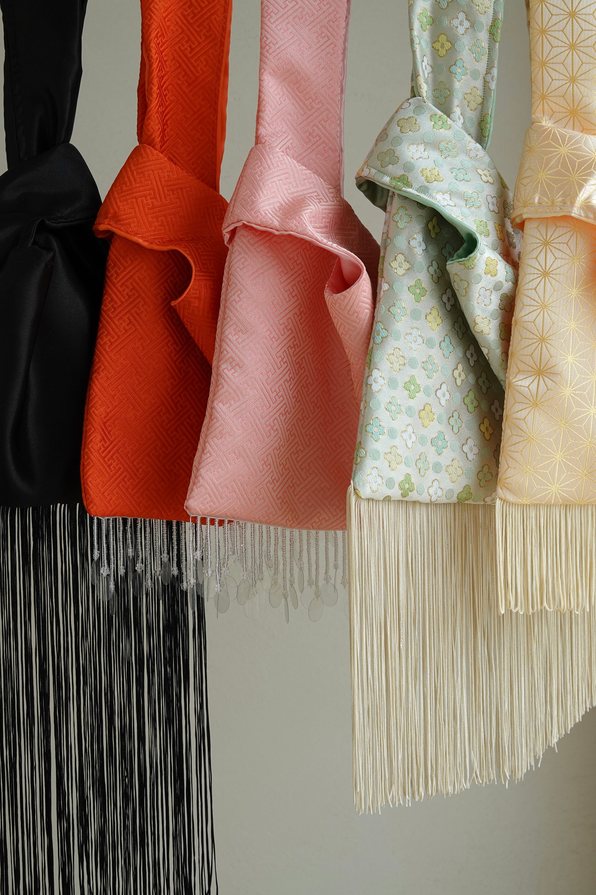 Collection of colorful bags with fringe 