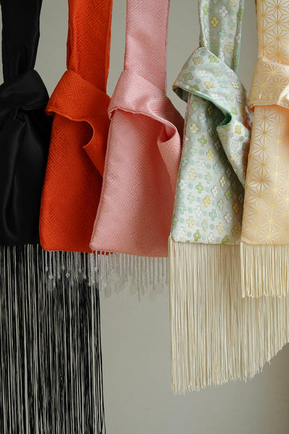 Collection of colorful bags with fringe 